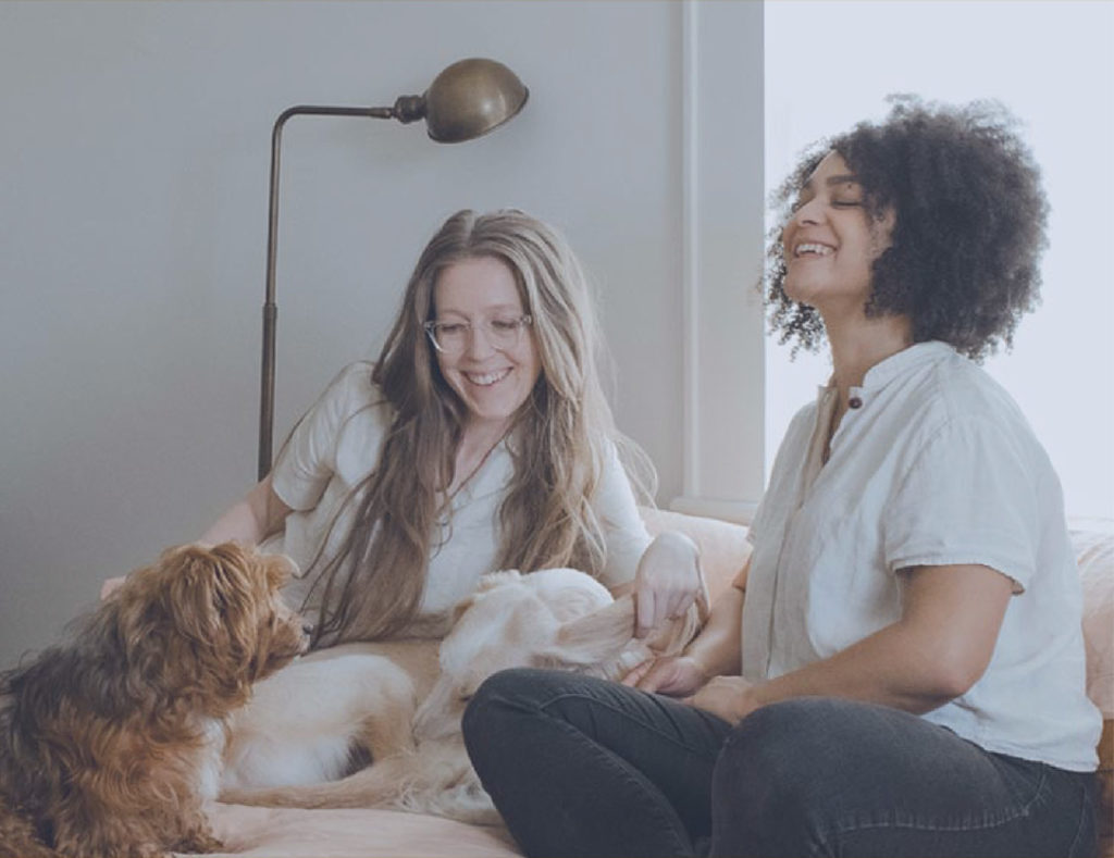 Two women with a dog