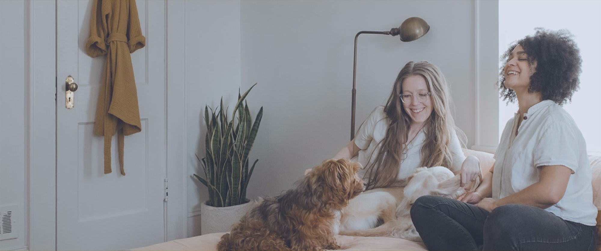 Two women with a dog