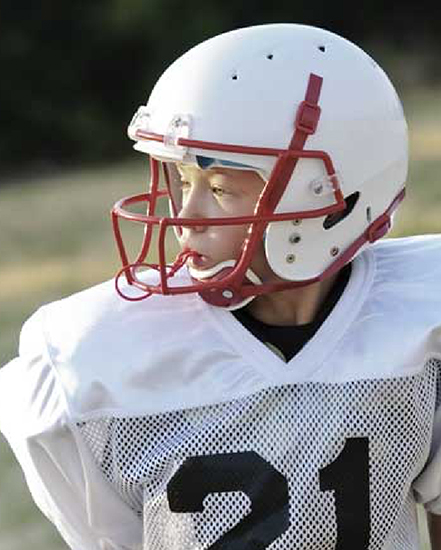 Child in football uniform