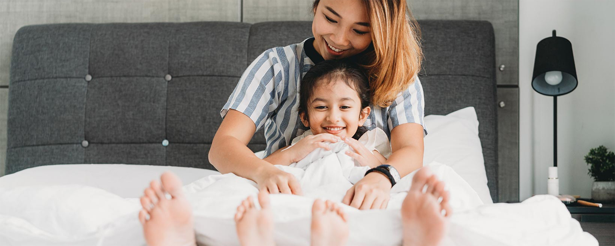 Mother and child on bed