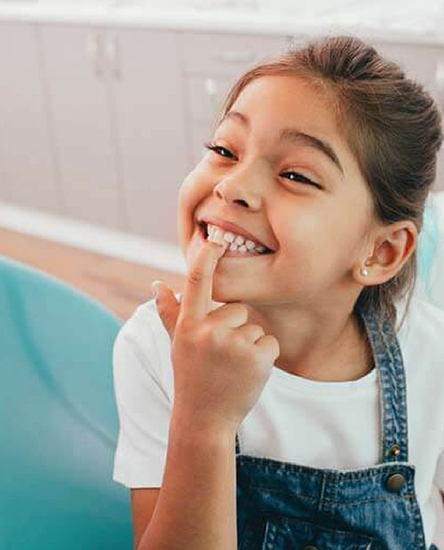 Child pointing at teeth