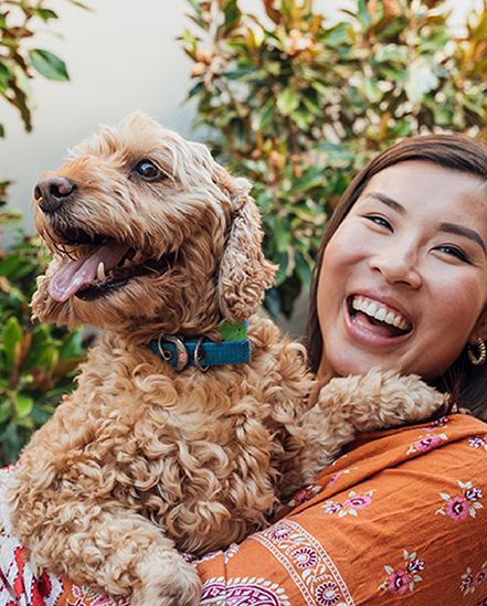 Girl smiling with dog