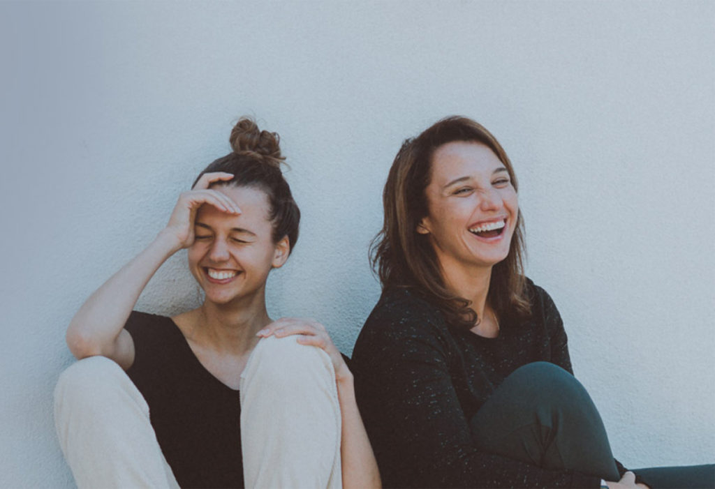 Two women laughing