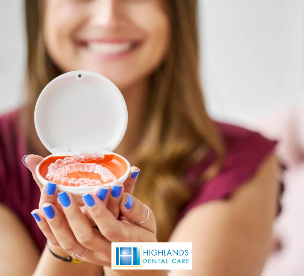 woman showcasing the dental prosthetic debture